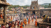 Devotees visiting a traditional Hindu temple complex during a religious pilgrimage in India.